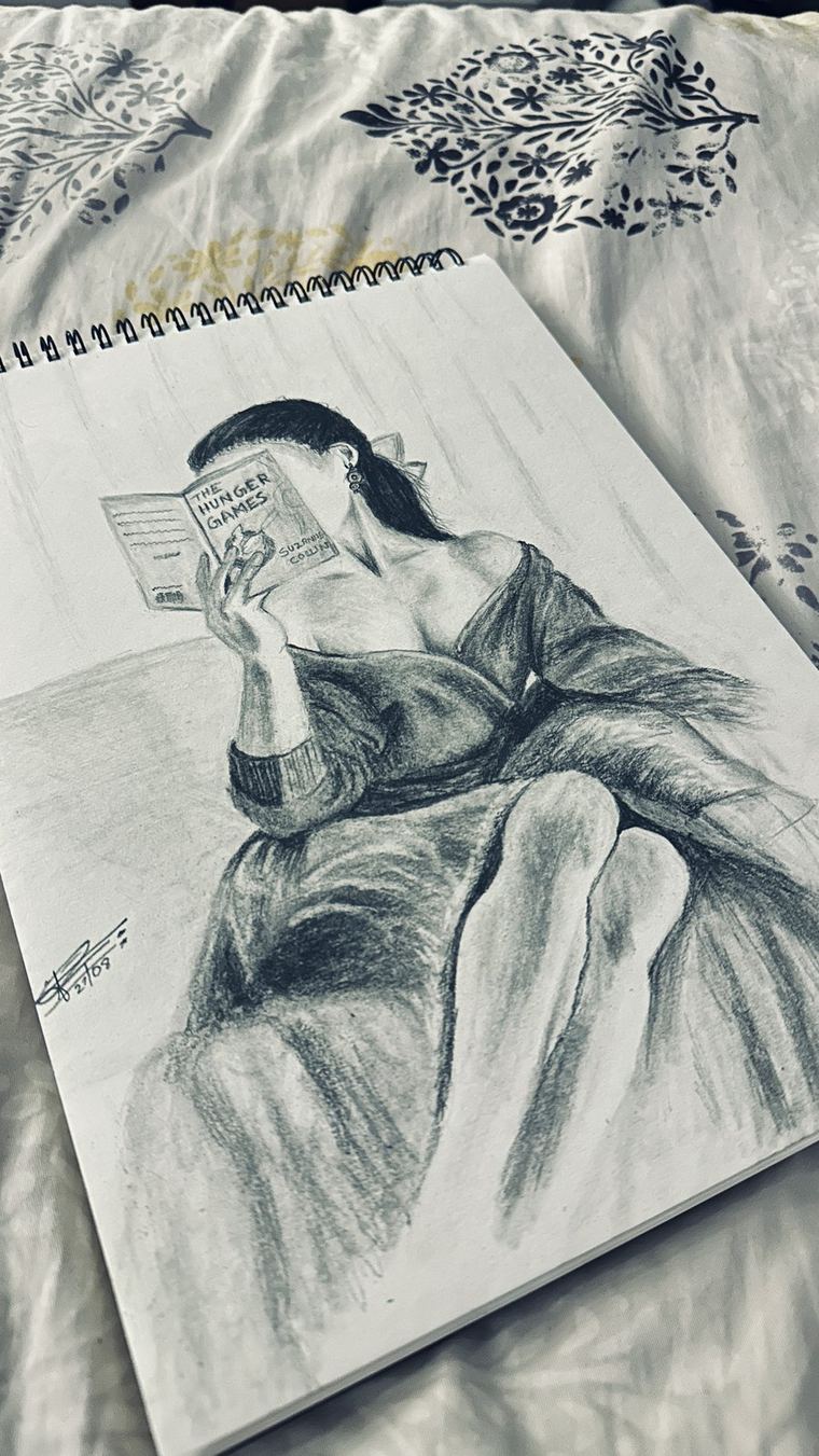 Sketchbook page with a figure study in graphite